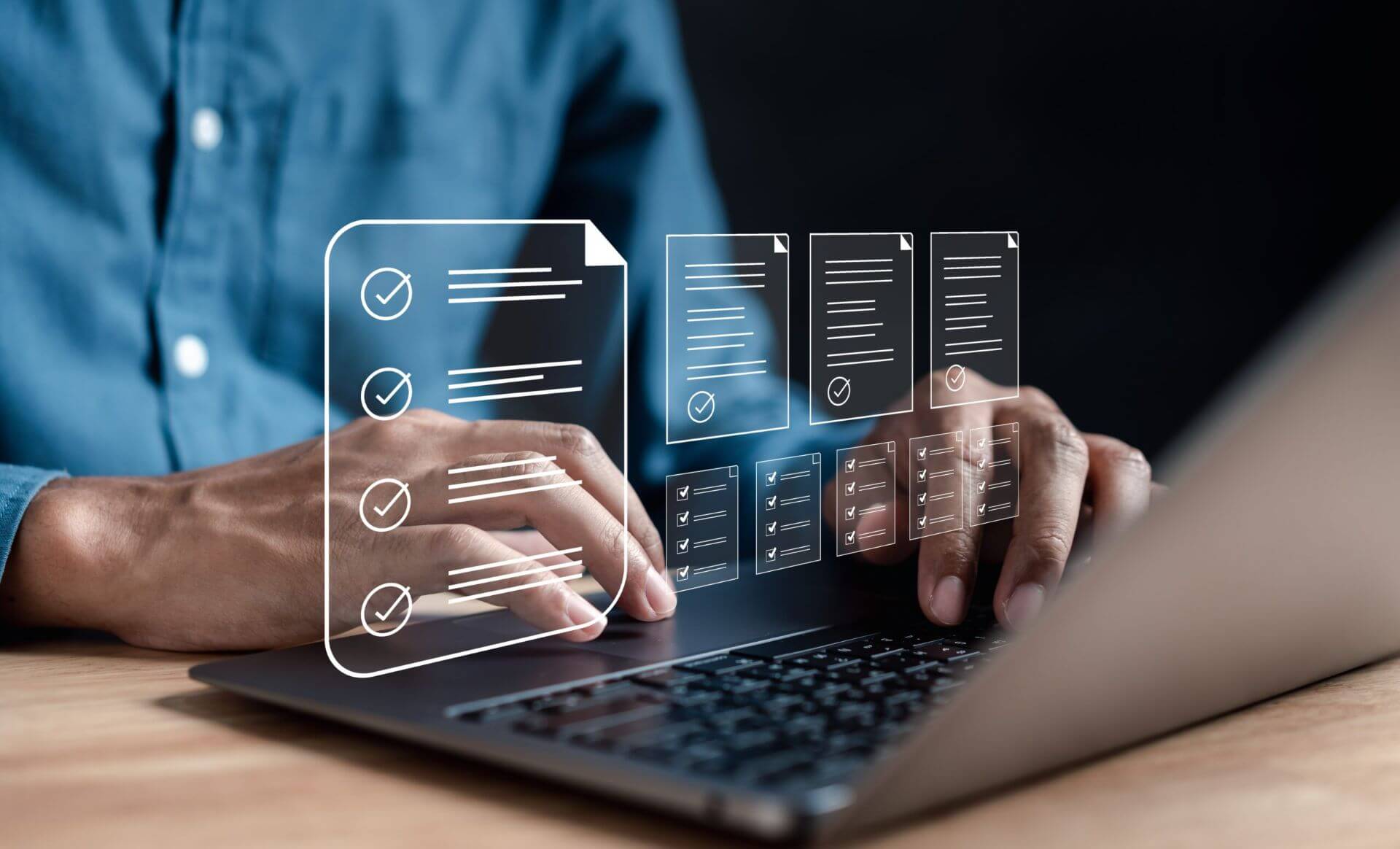 A Person Using a Laptop Displaying Checklists and Data Management Graphics